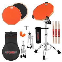 an orange and black drum set with accessories