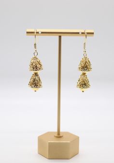 The Gold Filigree Decor Drop Earrings feature intricate filigree patterns that elegantly dangle, creating a delicate and captivating accessory with a touch of vintage charm. These earrings effortlessly enhance your style with their ornate design, making them a versatile and eye-catching addition to your collection. Victorian Gold Filigree Chandelier Earrings, Antique Gold Earrings With Intricate Design For Festive Occasions, Festive Antique Gold Earrings With Intricate Design, Ornate Filigree Chandelier Earrings For Formal Occasions, Elegant Metal Earrings For Festive Occasions, Elegant Metal Hoop Earrings For Festive Occasions, Ornate Chandelier Earrings, Formal Metal Earrings With Latkans, Elegant Festive Hoop Earrings