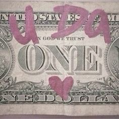 an old one dollar bill with pink hearts on it's face and the words,