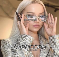 a woman wearing glasses with the caption capricorn written on her face in front of her