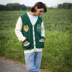 Show your Hawkins High School Pride by getting into uniform with our cozy knit cardigan featuring embroidered chenille patches. Go Tigers! 100% Acrylic Oversized Unisex Fit Embroidered Chenille Patches Stranger Things x Cakeworthy Licensed Product. Model Sizes: Male Model: Medium Female Model: Small Hawkins High School, School Cardigan, Go Tigers, Chenille Patches, School Pride, Cozy Knit, Female Model, Cozy Knits, Male Model