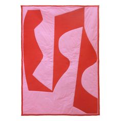 a pink and red abstract quilt on a white background