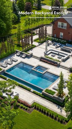 an aerial view of a backyard with a pool and lounge chairs in the middle of it