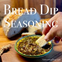 a person dipping bread into a bowl with seasoning on it and the words bread dip seasoning in front of them