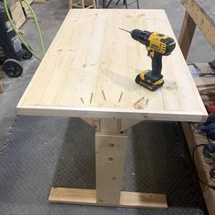 a driller is on top of a wooden table