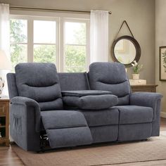 the reclining loveseat has two seats and is in front of a window