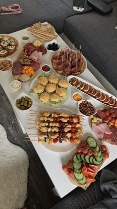 a table topped with lots of different types of food