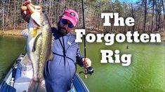 a man in a boat holding a large fish