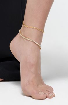 A 14-karat gold plate finish gives an enduring shine to this set of delicate crystal and paper-link chain anklets. Two-piece set 10" length Crystal glass/14K gold plate Imported Elegant Gold Chain Anklet, Elegant Yellow Gold Chain Anklets, Flip Flop Slippers, Designer Crossbody Bags, Chain Anklet, Sandals Brands, Sweaters And Leggings, Keep Jewelry, Fine Jewellery Earrings