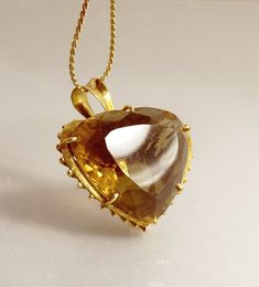 "Large 14K Gold Smoky Topaz Quartz Heart Pendant Vintage Jewelry Amazing, Large, Vintage Heart Pendant 14K Yellow Gold, High Basket Prong Setting, With Vertical Supports This Unique, Elegant Pendant Measures 1 1/4\" W x 1/8\" High  Not Including The Bail, 1.5\" With The Bail x 7/8\" Depth It Is Hallmarked For Gold On The Bail, But Unreadable As  To Maker Or Content Chain Is For Photos Only The Chain Is Not Included ! Jeweler Tested At 14K  Total Weight 17.5 Grams  jujubee1.etsy.com  To Browse My Pear-shaped Topaz Jewelry For Anniversary, Antique Yellow Gold Heart Cut Jewelry, Heirloom Heart Cut Gemstone Jewelry, Heirloom Heart Cut Diamond Jewelry, Heart Cut Topaz Gemstone Jewelry, Heart Cut Topaz Jewelry For Anniversary, Heirloom Faceted Gold Jewelry, Antique Heart Cut Jewelry For Formal Occasions, Faceted Pear-shaped Wedding Jewelry