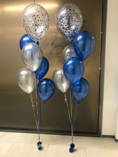 blue and silver balloons in front of an elevator