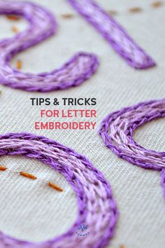 some purple thread on top of a white cloth with the words tips and tricks for letter embroidery