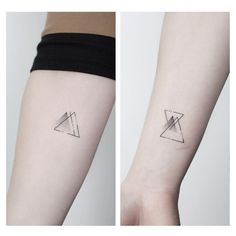 two different tattoos on the arm and one has a triangle tattoo on its left side