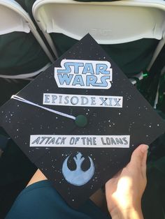 someone is holding up a star wars graduation cap