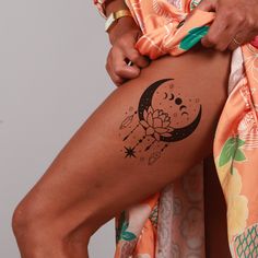 a woman's leg with a tattoo on it