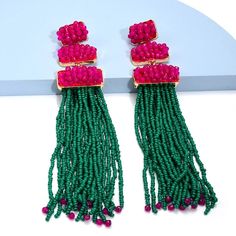 Doll up for your next night out with these dazzling resin tassel drop earrings! These earrings are the perfect accent for any outfit and will make everyone want a pair! With their unique shape and fun tassel detail, these stylish earrings will have heads turning wherever you Hot Pink Earrings, Long Tassel Earrings, Tassel Drop Earrings, Stylish Earring, Jewelry Wholesale, Pink Earrings, Trendy Accessories, Green Bead, Ear Jewelry