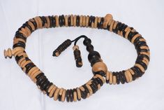 Tuareg Tasbih Wood Sangho , mauritanie Tasbih , TASBIH Sahraoui Dispose de ------ Matériel ◈ : good quality wood Région de ◈ : Afrique, Afrique du Nord, Maghreb, Maroc, vallée du Draa La culture ◈ : africain, berbère,touareg Nom vernaculaire ◈ : sabha sahraoui ◈ utiliser : ◈ technique : argent et bronze Poids ◈ : 300 g Longueur ◈ :90 cm Largeur ◈ : 2.6 cm Traditional Handmade Brown Rosary, Traditional Handmade Rosary, Traditional Adjustable Brown Rosary, Moroccan Table, Dazzling Earrings, Prayer Beads, Good Quality, Morocco, Mens Bracelet