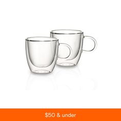 two clear coffee mugs sitting next to each other