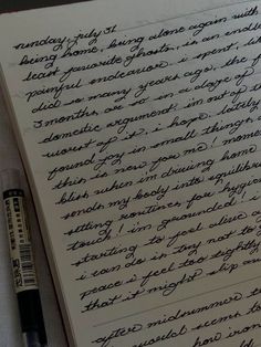 an old handwritten letter with writing on it next to a pen and paper clipping