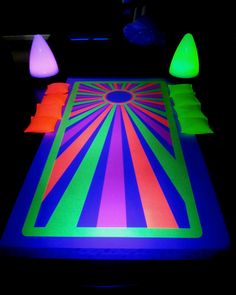 an illuminated table with neon colors on it