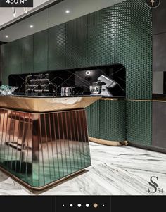 a kitchen with green walls and marble counter tops in a room that has metallic panels on the wall