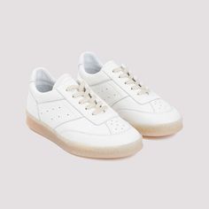 Looking for a pair of shoes that blend style and comfort effortlessly? These are crafted from luxurious 100% calf leather, offering both durability and a sleek look. Perfect for adding a touch of elegance to your casual outfits. Season: FW24 Color: WHITE Made in: ITALY Composition: LEATHER | 100%CALF LEATHER | Mm6 Maison Margiela Women's Sneakers in White | Size IT 39+ | S59WS0212P7016 Margiela Sneakers, Sneaker Boutique, Caged Sandals, Black Aviators, Balenciaga Designer, Mm6 Maison Margiela, Pure White, Lace Tops, Sneakers White