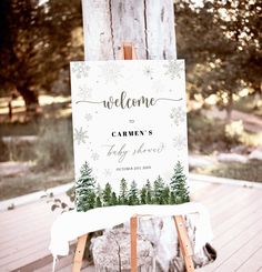 an easel with a welcome sign on it