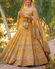 a woman in a yellow lehenga