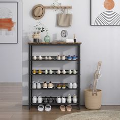 a shelf filled with lots of shoes next to a rug and pictures on the wall