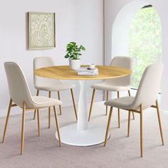 a round table with four chairs around it