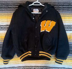 "Vintage 70's/80's Letterman Jacket w/ Convertible Hood Tag marked \"MB\" Size | Adult LARGE | Dimensions | Shoulder to Shoulder: 25\" - Neck to Waist: 22\" | Materials | 80% Wool - 20% Rayon | Place of Origin | USA Greenville, Ohio | Manufacturer | NEFF |" Retro Hooded Varsity Jacket For Fall, 90s Style Winter College Varsity Jacket, 90s Style Hooded Outerwear For College, Vintage Hooded Varsity Jacket For Winter, Retro Winter Varsity Jacket, Winter Throwback Hooded Varsity Jacket, Vintage Black Varsity Jacket For Winter, Vintage Long Sleeve Varsity Jacket For Outdoor, Vintage College Outerwear With Pockets