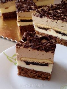 several pieces of cake sitting on top of a white plate