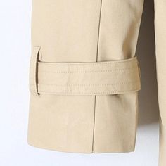 Made from 100% organic cotton, this trench coat features an eco-friendly, breathable, and hypoallergenic material. To maintain its quality, simply machine wash on low or delicate, and dry gently on low heat. It's the perfect gift for any occasion, making every day special for the little one in your life. Long Sleeve Cotton Raincoat For Work, Cotton Long Sleeve Raincoat For Fall, Winter Long Sleeve Cotton Raincoat, Fall Cotton Raincoat For Workwear, Fall Cotton Raincoat For Work, Cotton Raincoat For Workwear In Fall, Belted Beige Cotton Outerwear, Beige Long Cotton Coat, Beige Cotton Long Coat