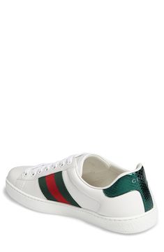 Signature web stripes and bold embroidery bring together two of Gucci's most distinctive house codes on this classic leather sneaker. Contrasting heel tabs are a modern reference to the brand's official colors. Style Name:Gucci New Ace Sneaker (Men). Style Number: 5415061. Luxury Gucci Sneakers With Embroidered Logo, Gucci Leather Sneakers With Embroidered Logo, White Sneakers With Signature Stripes For Streetwear, Gucci Custom Sneakers With Embroidered Logo For Streetwear, White Sneakers With Signature Stripes And Round Toe, White Round Toe Sneakers With Signature Stripes, Gucci Designer Sneakers With Embroidered Logo, Designer Gucci Sneakers With Embroidered Logo, Classic Gucci Sneakers With Embossed Logo