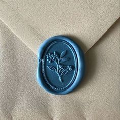 a wax stamp with a flower on it