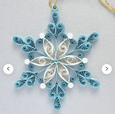 an ornament made out of paper and string