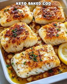 baked fish with lemon and parsley in a white casserole dish