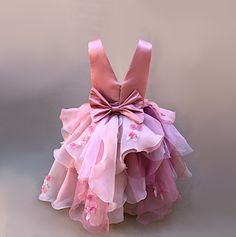 This custom flower petal organza dress for girls is sure to make her feel like a princess! The super puffy layers of organza petals create a stunning and elegant look, finished off with pretty flower 3D lace for an extra touch of charm. Perfect for weddings, parties, or any special event, this dress will have your little one stealing the show in style. Size Guide: 1) All our Gowns can be made in any size ranging from Kids 2T to Adult Plus Sizes. 2) Ordering based on Size Chart: Before you place your order please compare your measurements to the size chart provided. 3) Ordering Custom: If you choose to submit custom measurements, we will be adding an inch to the chest and waist circumference to allow room for some ease. Production Time: Production time is usually 5 days but varies greatly d Pink Tulle Princess Dress With Floral Applique, Party Dresses With 3d Flowers In Tulle, Tulle Dress With 3d Flowers For Party, Party Dresses With 3d Flowers And Tulle, Wedding Pageant Dress With Ruffles And Organza, Pink Flower Princess Dress For Dress-up, Pink Organza Ball Gown For Spring, Spring Pink Organza Ball Gown, Spring Pink Ball Gown With Ruffles