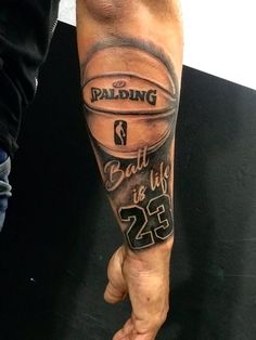 a man with a basketball tattoo on his arm