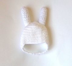 a crocheted white bunny hat with ears