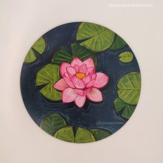 a painting of a pink flower on top of water lilies with green leaves around it