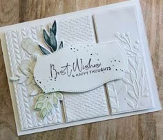 a white card with flowers and leaves on it, which reads best wishes happy thoughts