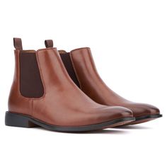 Introducing the Harrison, the ultimate Fall Chelsea boot that epitomizes sophisticated style. Crafted with a sleek faux leather upper, this boot features classic gores on each side and a convenient pull tab for easy on and off access. Perfect for everyday wear, the Harrison combines timeless design with modern comfort, making it your go to choice for the season. Elevate your fall wardrobe with the Harrison Chelsea boot, where elegance meets practicality. Classic High-top Chelsea Boots For Fall, Fitted Chelsea Boots With Plain Toe For Fall, Fitted Moc Toe Chelsea Boots For Fall, Business Boots With Plain Toe In Faux Leather, Business Boots In Faux Leather With Plain Toe, Faux Leather Business Boots With Plain Toe, Formal Ankle-high Faux Leather Chelsea Boots, Ankle-high Faux Leather Boots For Business, Classic Winter Boots In Faux Leather