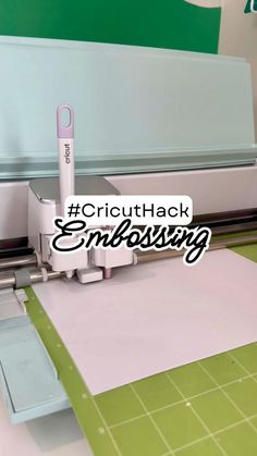 the cricuthack embossing machine is cutting paper with a pink pen