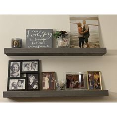 two wooden shelves with pictures and photos on them, one is holding a couple's photo