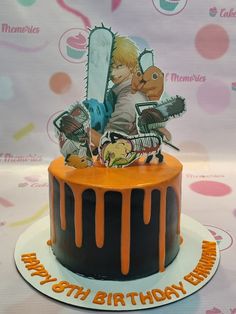 a birthday cake with an image of a boy holding a knife on top of it