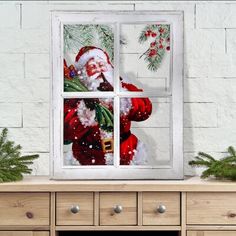 santa claus looking out the window with christmas decorations on it's windowsill, in front of a white brick wall