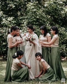 a group of women standing next to each other