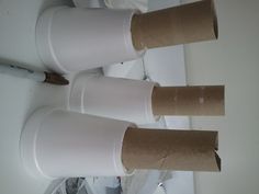 three rolls of toilet paper sitting on top of each other