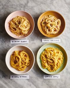 four bowls filled with different types of pasta